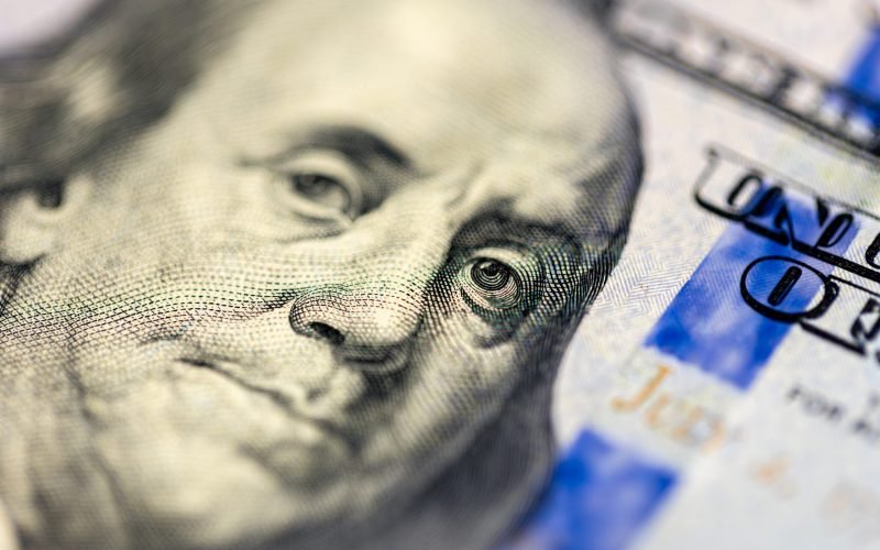 Close-up image of Benjamin Franklin on 100 bill. Finance concept. Money background. High quality photo